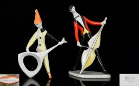 Two Mid Century Hungarian Porcelain Figurines By Aquincum Each in the form of standing musicians,