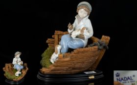 Nadal - Lladro Style Fine Quality Hand Painted Porcelain Figurine - Young Boy with puppies sitting