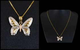 A beautiful 9 ct gold butterfly pendant & Chain, In a tri-colour design,