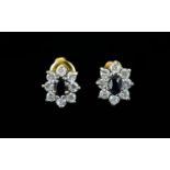 Ladies - Nice Quality Flower Head Design Earrings Dark faceted central stone, surrounded by CZ. Good