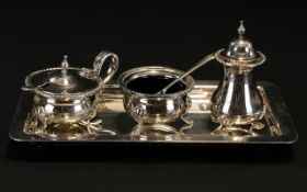 A silver plated Cruet Set Early 20th Century four piece set to include rectangular tray,