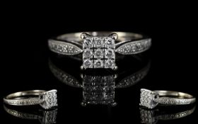 A 9ct White Gold Diamond Cluster Ring Set with 9 brilliant cut diamonds, finished with diamond