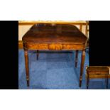 An Early 19th Century Mahogany Tea Table With fold over top, turned legs.
