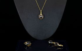 A Contemporary Silver Vermeil And Smoky Topaz Jewellery Suite Comprising pendant necklace, wired