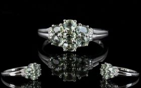 Green Sapphire Seven Stone Cluster Ring, seven oval cuts of the olive green 'fancy' sapphire,