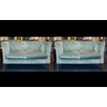 A Pair Of Two Seater Button Back Settee's High back sofas with button arms,