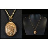Ladies 9ct Gold Small Oval Shaped Hinged Locket / Pendant with Attached 9ct Gold Chain. Marked