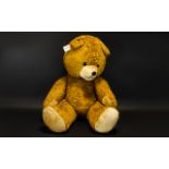A Large Vintage Jointed Teddy Bear Of traditional construct with oversized head, black button eyes,