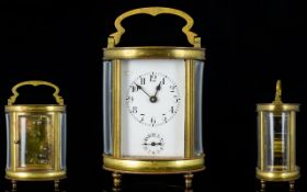 French - Late 19th Century Brass Oval Shaped and Footed Carriage Clock,