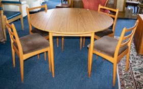 A 1970s Shreiber Dining Table and Four Chairs.