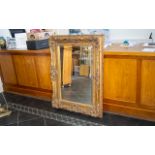 A Modern Large Gilt Framed Mirror. Bevelled glass mirror, 36" x 48", good condition.