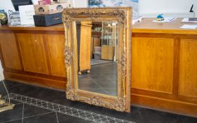 A Modern Large Gilt Framed Mirror. Bevelled glass mirror, 36" x 48", good condition.