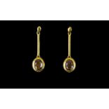 Golden Lustre Sapphire Drop Earrings, 5cts over two oval cut solitaires of the natural golden lustre