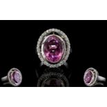 Kunzite Quartz and White Zircon Ring, a 9.5ct oval cut, deep pink, kunzite quartz solitaire, bezel