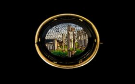Grand Tour 19th Century Micro Mosaic Brooch in gold tone/metal/pinchbeck oval shaped mount. The
