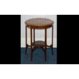 An Edwardian Occasional Table with inlaid ribbon banding to top and bottom stretcher,