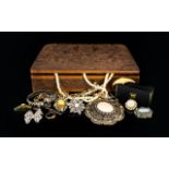 A Carved Wooden Box Containing A quantity Of Costume Jewellery Items A varied collection to include