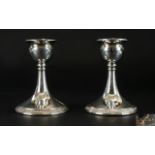 George V Pair of Silver Squat Candlesticks with Tapered Stems on a Circular Base.