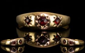 9ct Gold Three Stone Ruby Set Dress Ring fully Hallmarked for G375. Ring size O. Please see photo.