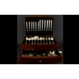 A Modern Canteen Of Cutlery Hinged top mahogany veneer box with single drawer and twin handles.