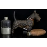 A Cast Metal Novelty Lighter In The Form Of A Highland Terrier Dog Along with two vintage hip