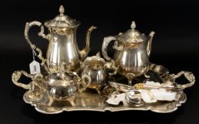 A Plated Coffee And Tea Service Comprising twin handle etched tray with accompanying teapot,