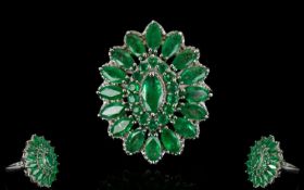 Emerald Marquise Shape Cluster Ring, a raised central marquise cut .5ct emerald, framed with round