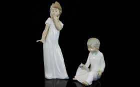 Nao by Lladro Pair of Porcelain Figures - Depict Young Boy and Girl In Nightdresses,