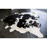 Large Cowhide Rug Of traditional form in chocolate brown and cream fur hide,