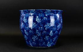 A Large Ceramic Planter The whole, transfer printed in blue and white floral and scroll repeat.