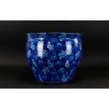 A Large Ceramic Planter The whole, transfer printed in blue and white floral and scroll repeat.