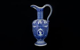 German Mettlach Style Blue And White Ewer The whole with foliate decoration.