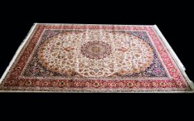 A Large Woven Silk Carpet Keshan rug with beige ground and traditional Middle Eastern floral and