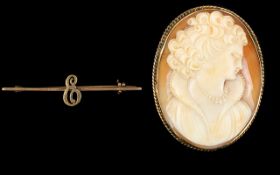 A 9ct Gold Mounted Shell Cameo Brooch Depicting a glamour girl, facing right,