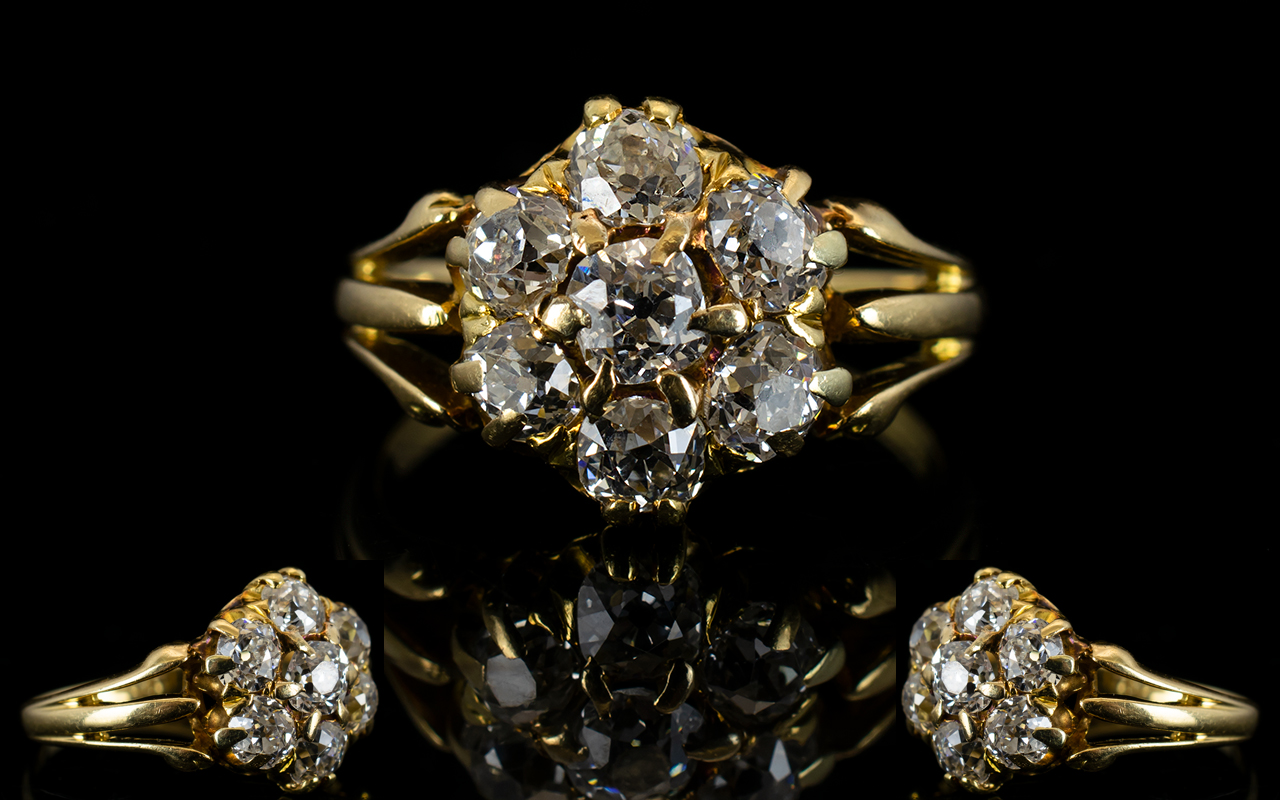 Antique 18ct Gold And Diamond Cluster Ring Set with seven old round cut diamonds in a flowerhead