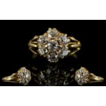 Antique 18ct Gold And Diamond Cluster Ring Set with seven old round cut diamonds in a flowerhead