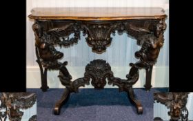 A Continental Adapted Console Table With figural supports and carved floral and dolphin decoration.