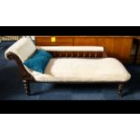 Chaise Longue Of large proportions with carved headrest and spindle back, raised on turned legs with