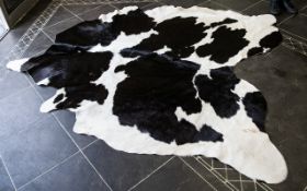 Large Cowhide Rug Of traditional form in