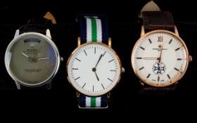 Three Gents Fashion Wristwatches - Stainless Steel Backs, Two Leather And One Fabric Strap.