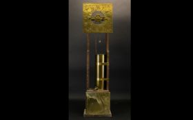 A Brass Water Gravity Clock Circa 1969 Of typical form with square brass dial,