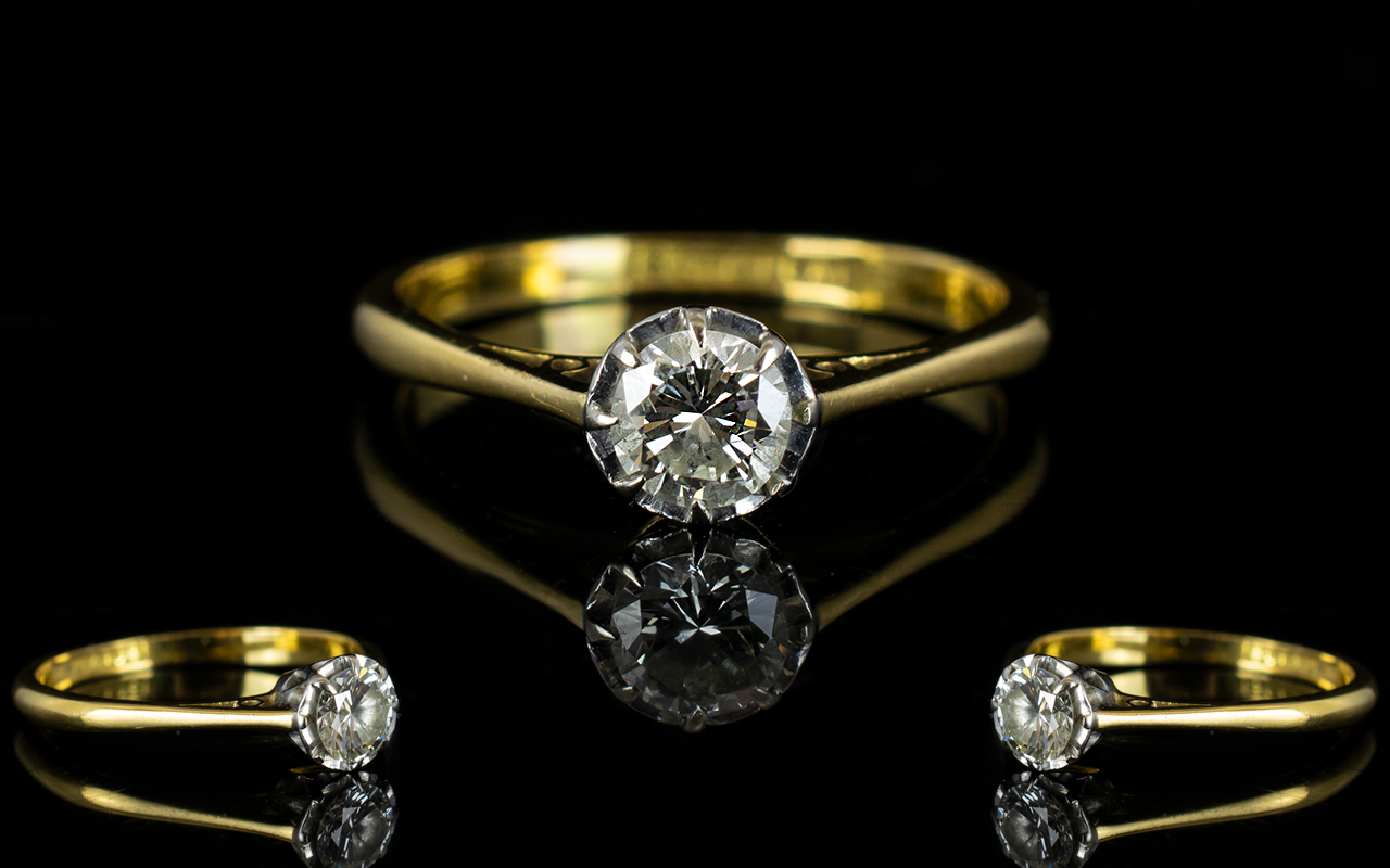 18ct Gold and Platinum Single Stone Diamond Ring - The round brilliant cut Diamond of excellent