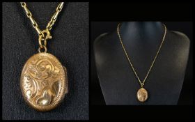 Ladies 9ct Gold Small Oval Shaped Hinged Locket / Pendant with Attached 9ct Gold Chain. Marked 9ct.