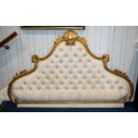 A 20thC Italian Gesso Framed Headboard with Baroque style scrolling shell frame and cream button