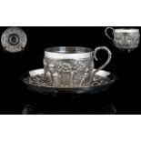 Late 19thC Oriental Handmade Embossed Silver Cup and Saucer decorated with embossed images of