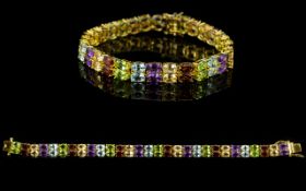 Two Row Multi Gemstone Line Bracelet, 29cts, comprising repeated pairs of amethysts, peridots,