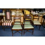 Four Victorian Dining Chairs Each with turned supports and cross stretcher,