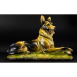 A Chalkware Figure In The Form Of A Recumbent German Shepherd Dog Some chips/damage to paint