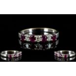 18ct White Gold - Attractive Ruby and Diamond Dress Ring, The Four Rubies Interspaced with Diamonds,