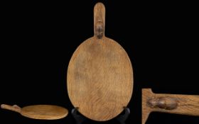 Robert Thompson of Kilburn 'Mouseman' oak oval cheese board with carved mouse signature,